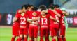 لاعب كرة قدم يرتدي قميص النادي الأهلي